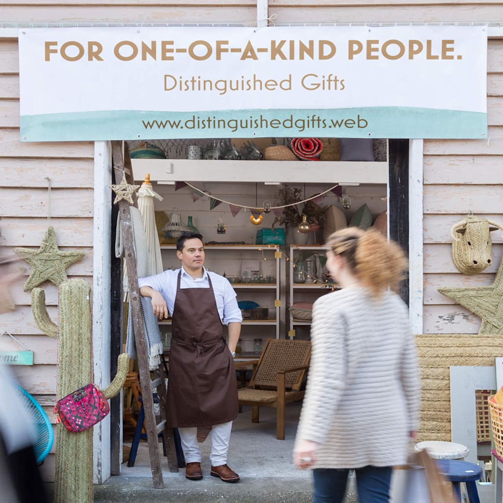 A banner promoting a gift shop, hung over the entrance.