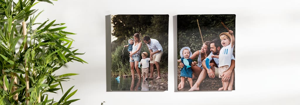 Two large canvases featuring family photos, side by side.