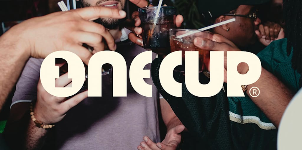 Bold off-white brand logo placed on a candid flashlight photo of people cheering with drinks