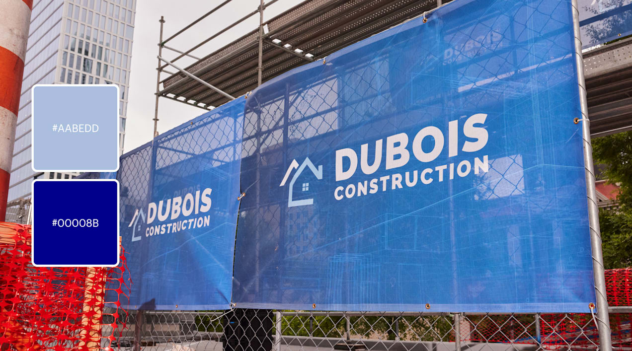 A light blue house logo for Dubois Construction on a banner in dark blue.