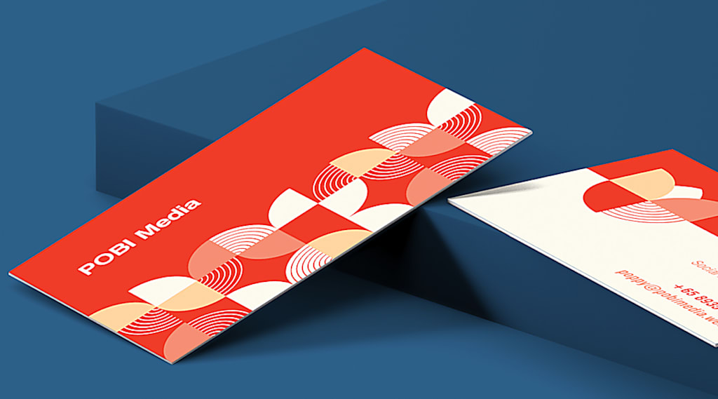 Business card that uses uncoated business card paper stock