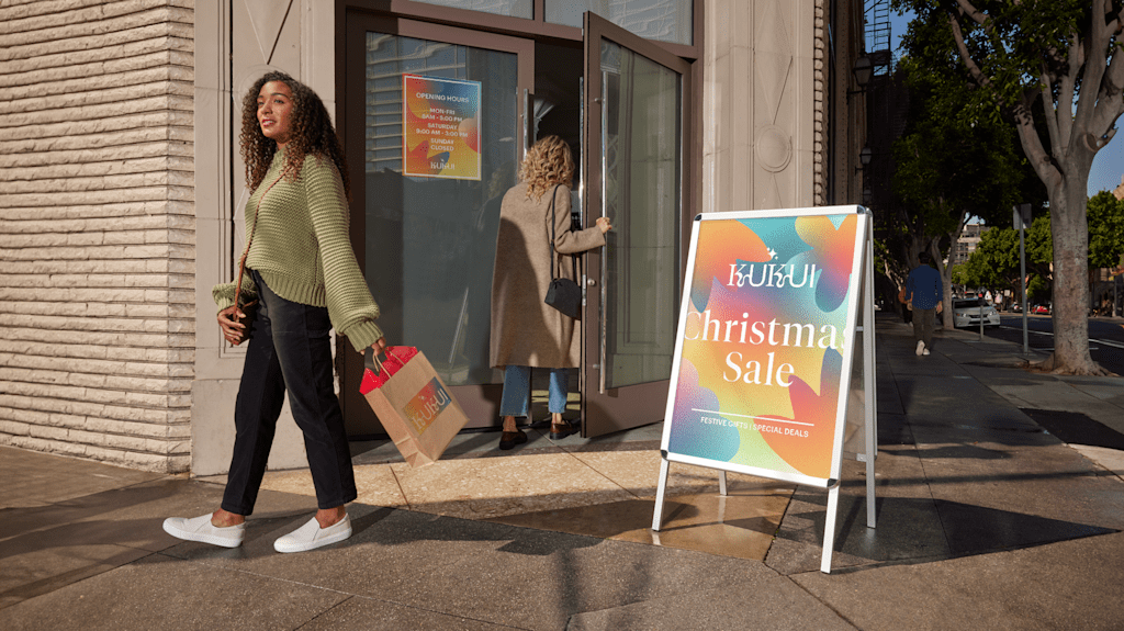 Promotional 60.96 cm x 91.44 cm A-frame sign as a part of a shopfront arrangement.