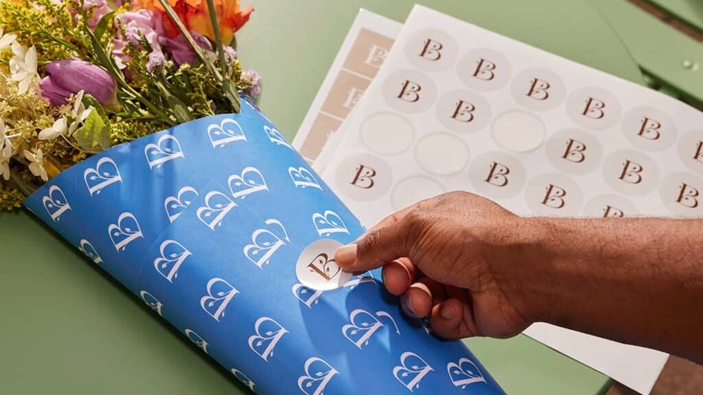 Custom logo on branded stickers and flower packaging