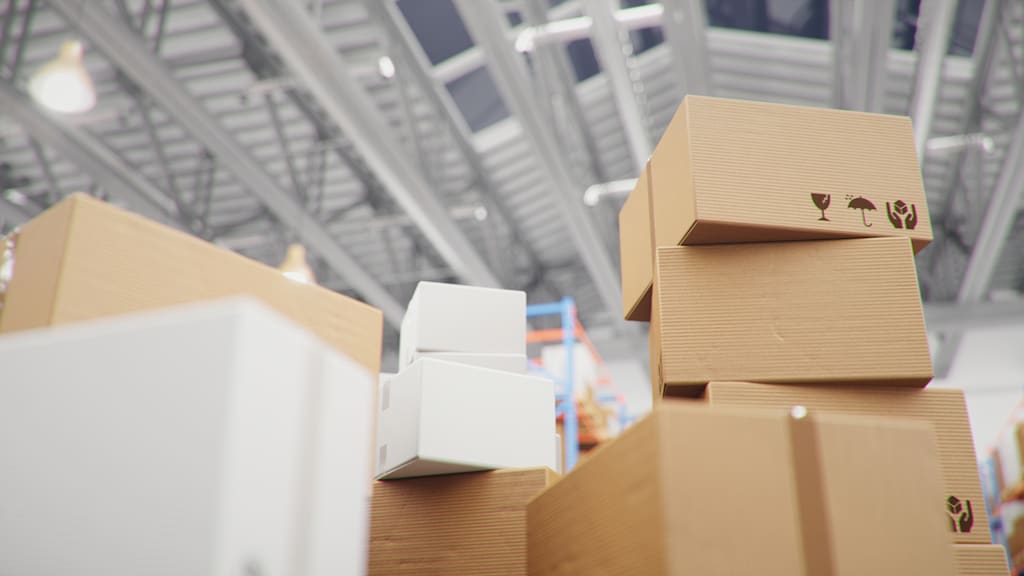 Cardboard boxes stacked in a warehouse.
