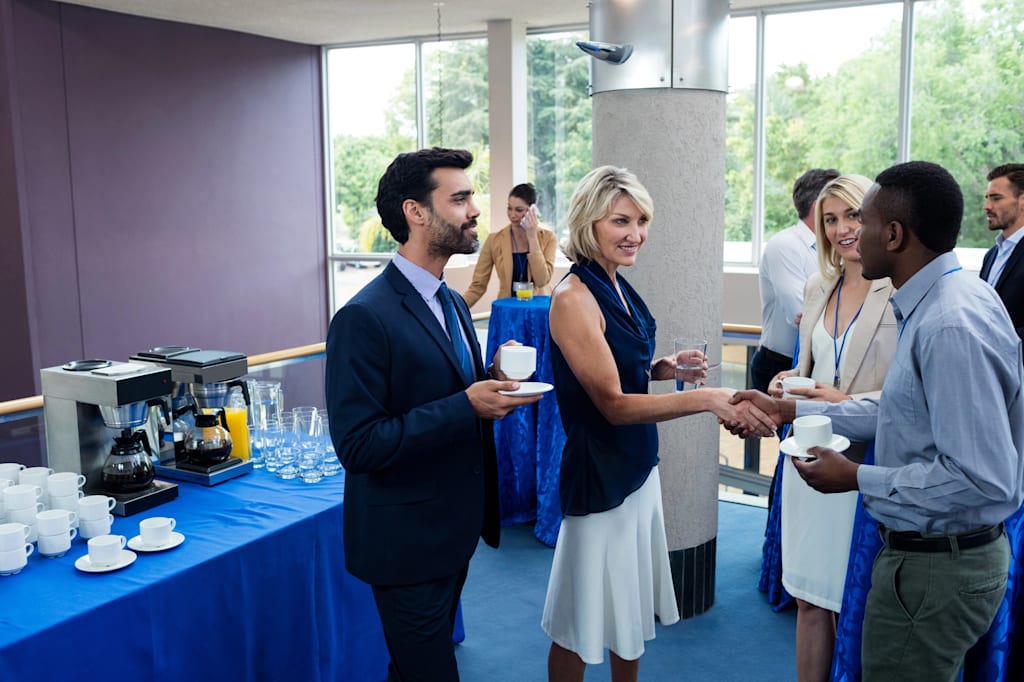 Shaking hands at networking event
