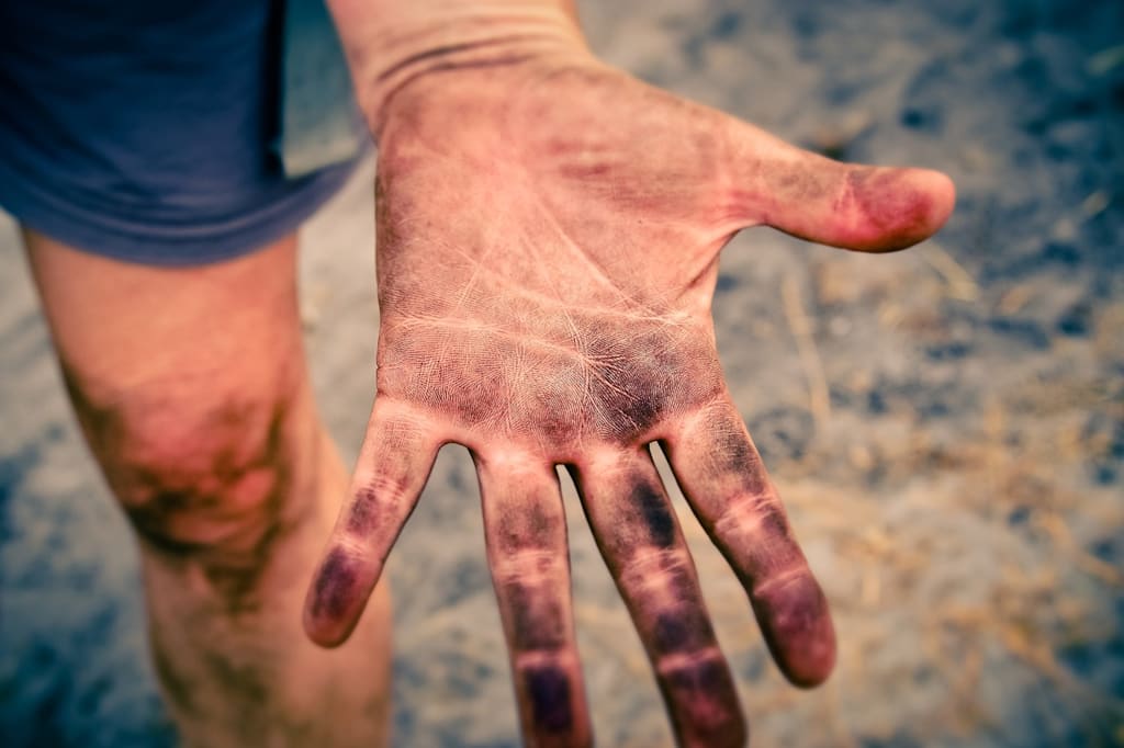 Close-up of a hand with dirt on it