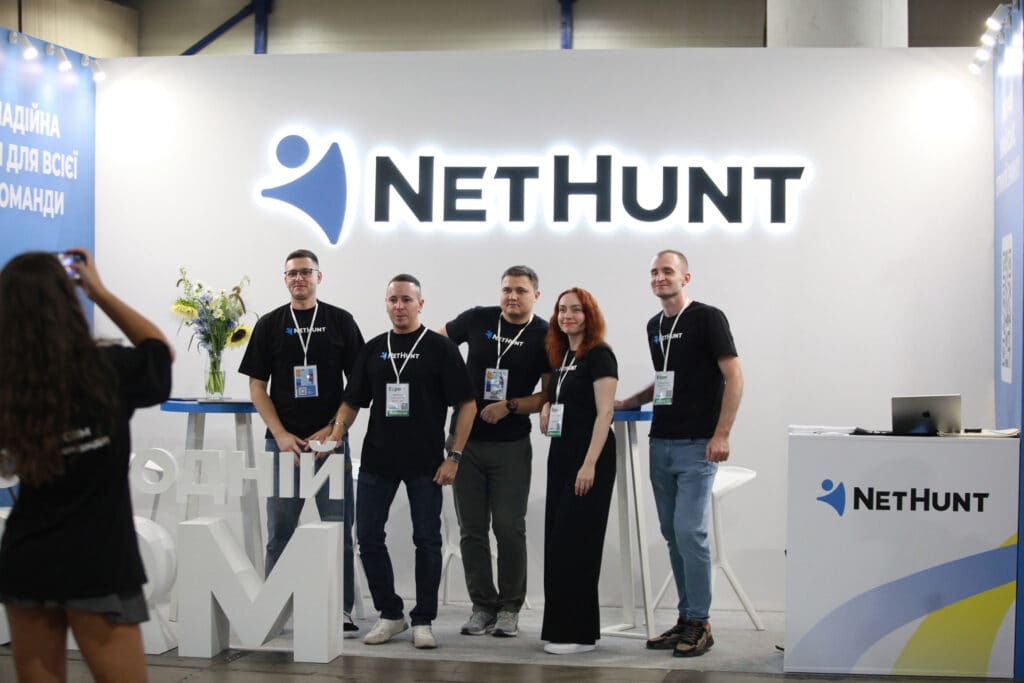 Staff wearing branded t-shirts at a trade show