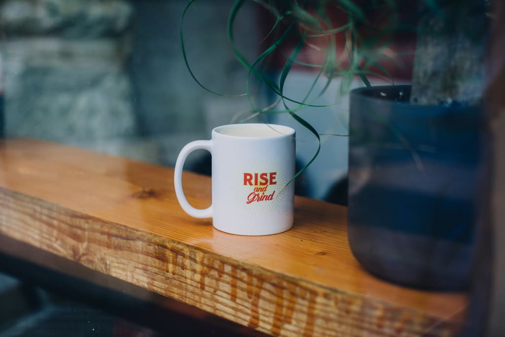 coffee mug design idea that says “Rise and Grind”
