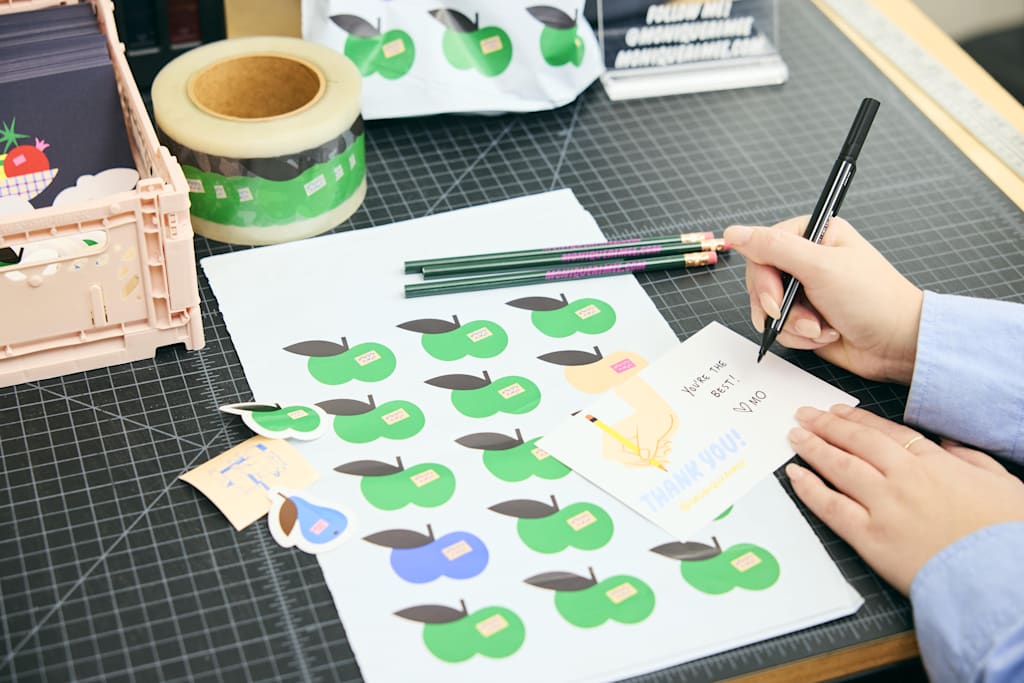 Hand designing a thank-you card