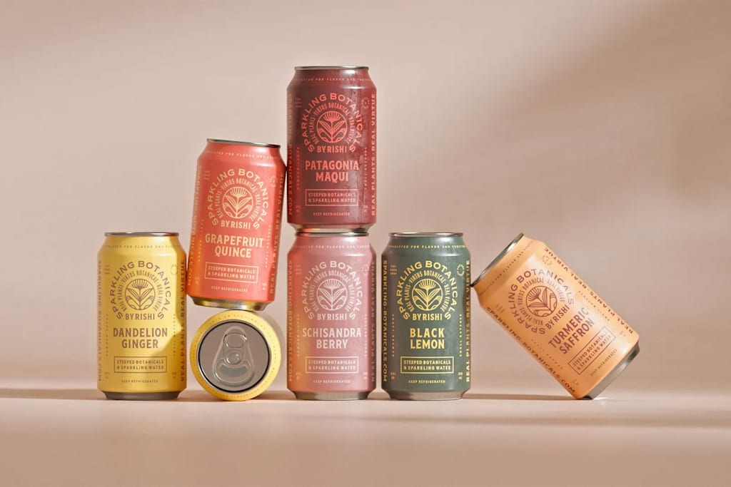 Minimalist sparkling water cans with monochrome labels, vintage typography and botanical illustrations—an example of the Apothecary Aesthetic packaging trend 2026