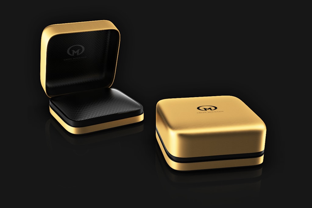 Gold ring box with black accents and outer cover