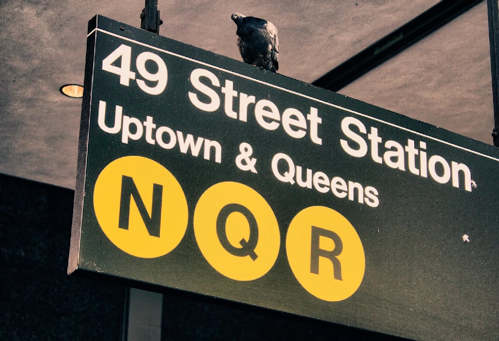 A New York City subway sign using Helvetica font