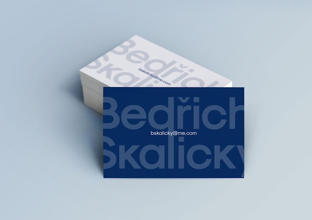 Real estate business card design with oversized wordmark on the back