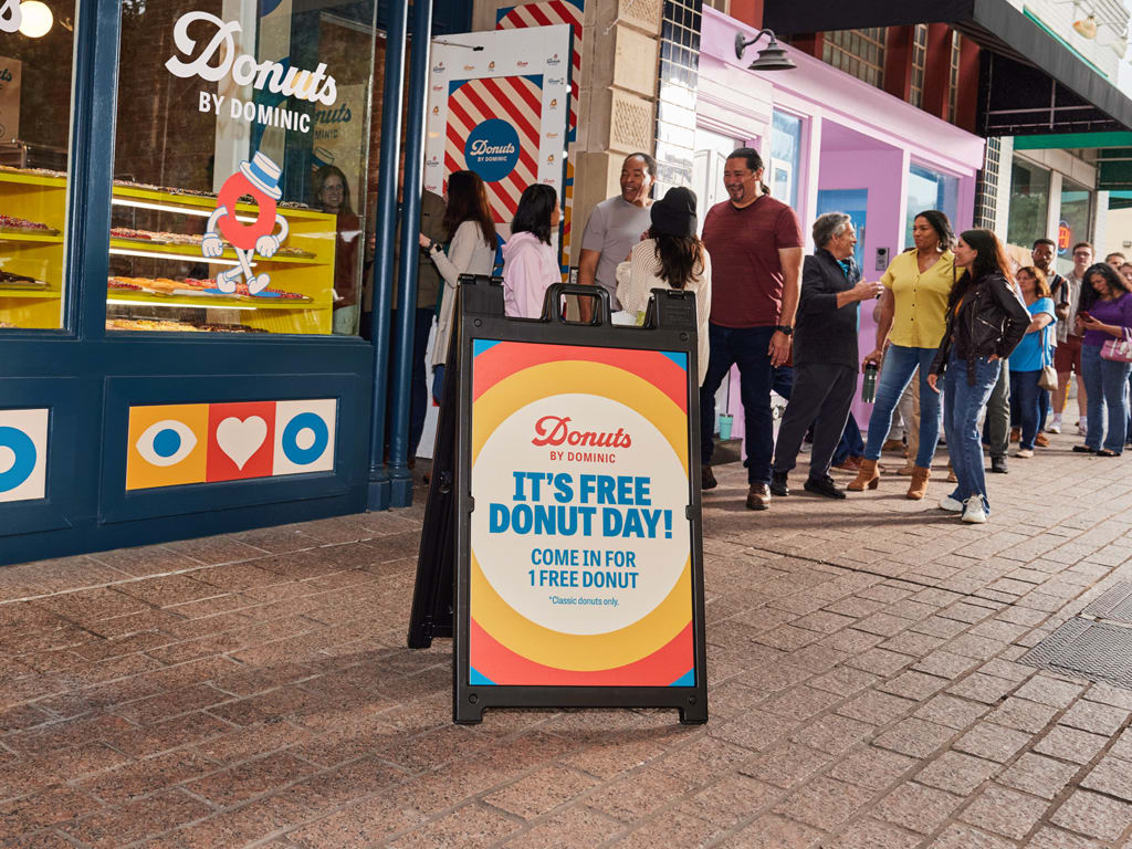 A-frame sign placed on the sidewalk to attract customers in stores.