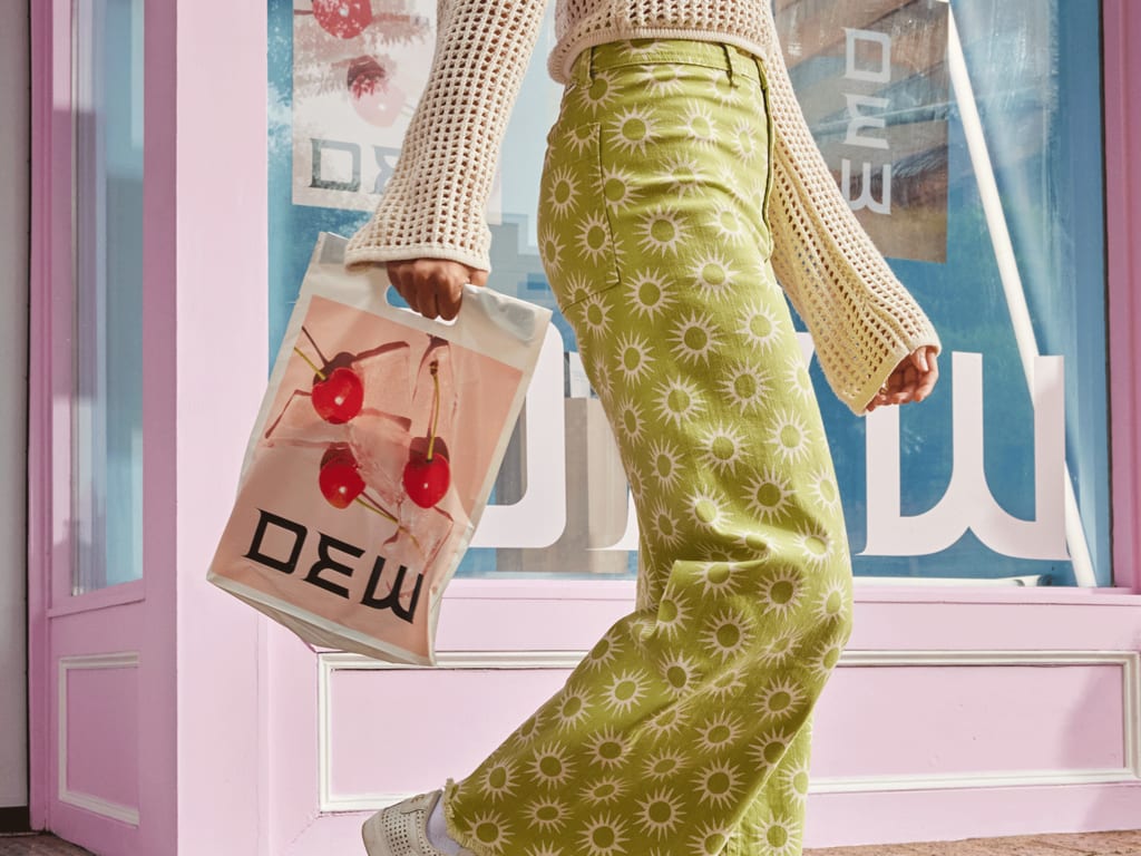 customer carrying branded shopping bag