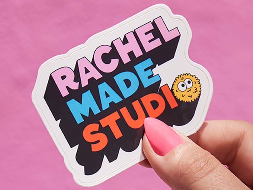 A branded sticker using a simple font and bold colors
