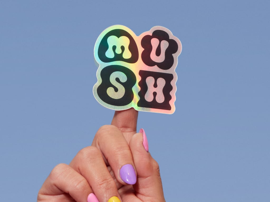 A branded holographic logo for MUSH