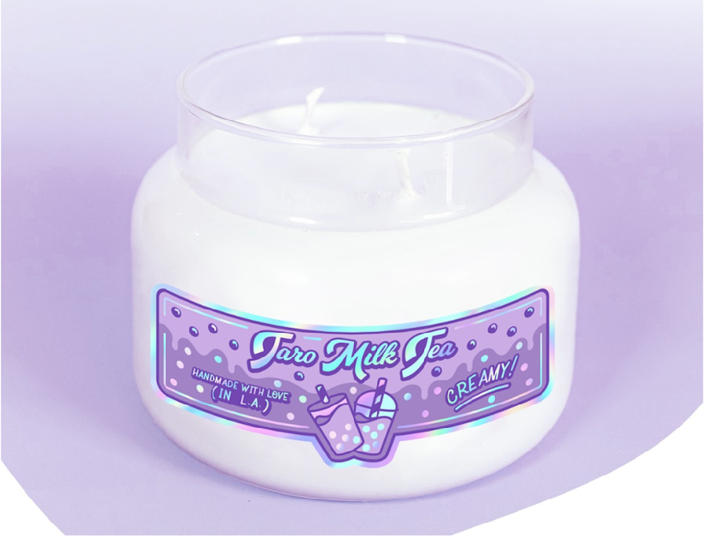 Flashy sticker on candle product in pastel blues and purples