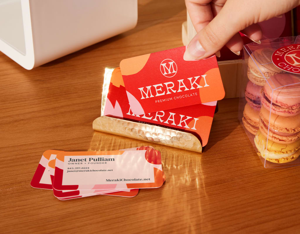 Bright-colored business cards with red, pink and orange color scheme