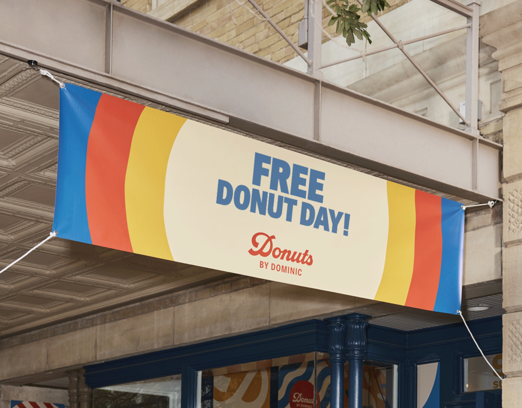 A hanging banner for a donut business signage.