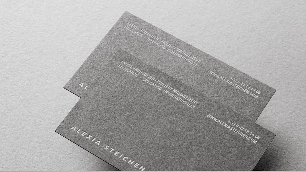 Letterpressed business card design with white matte foil stamping