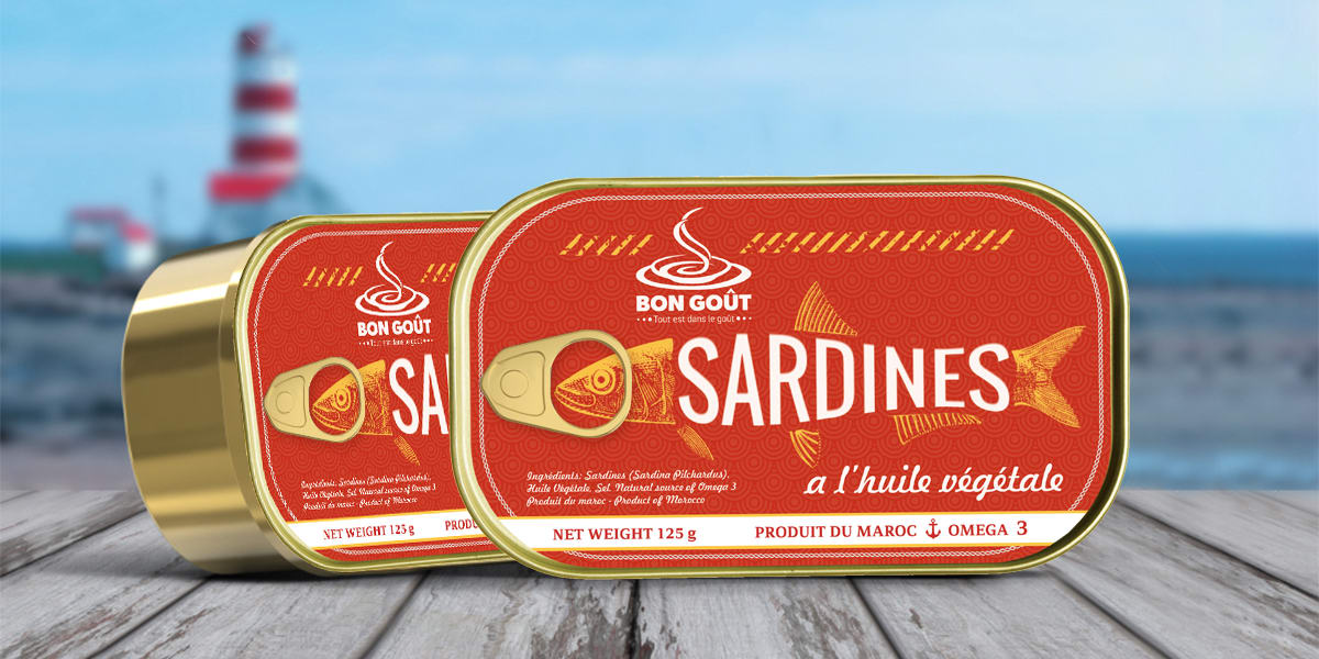 Gold sardine can with red label.