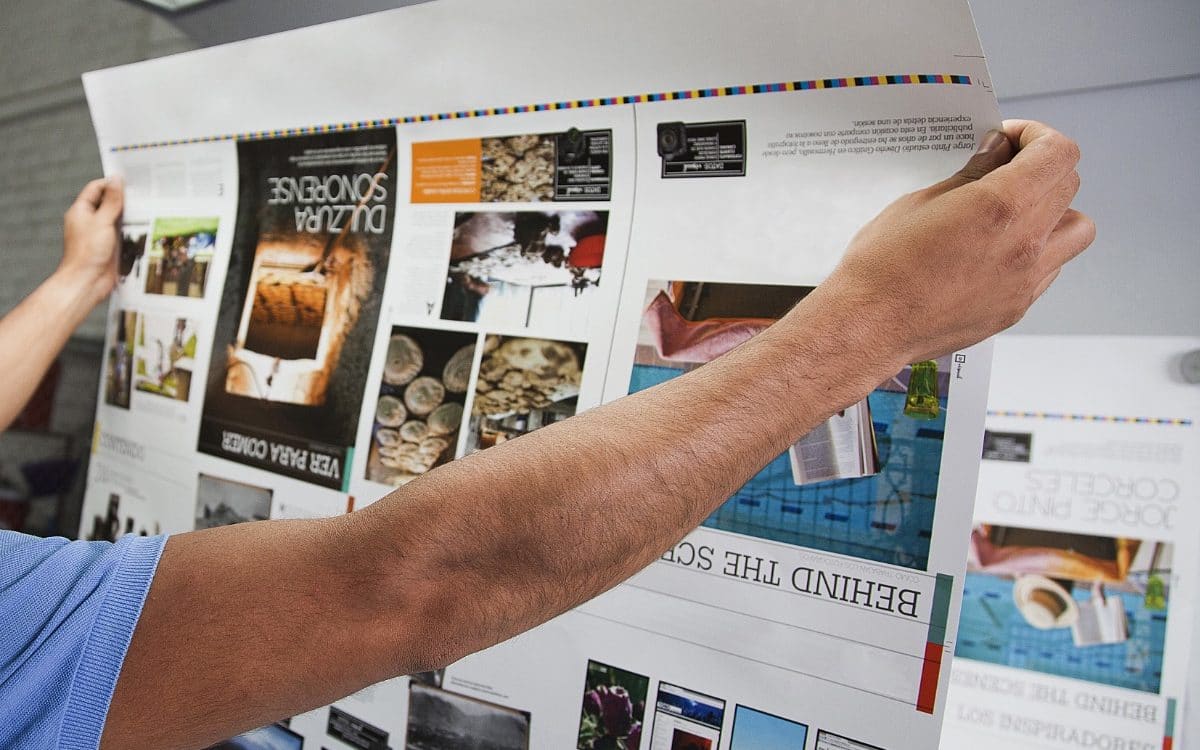 Close-up of a person checking an offset printing proof