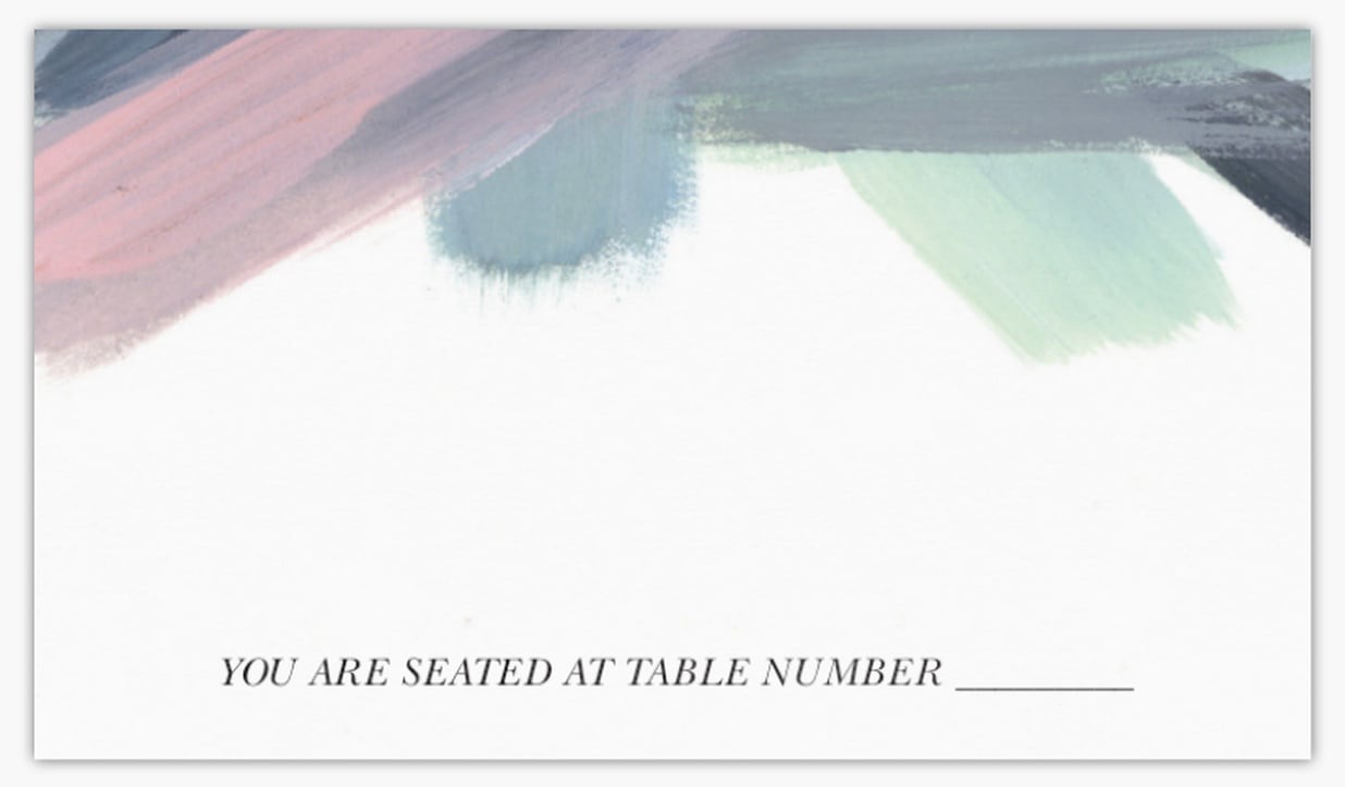 place card featuring multi-colored paint streaks along its top edge