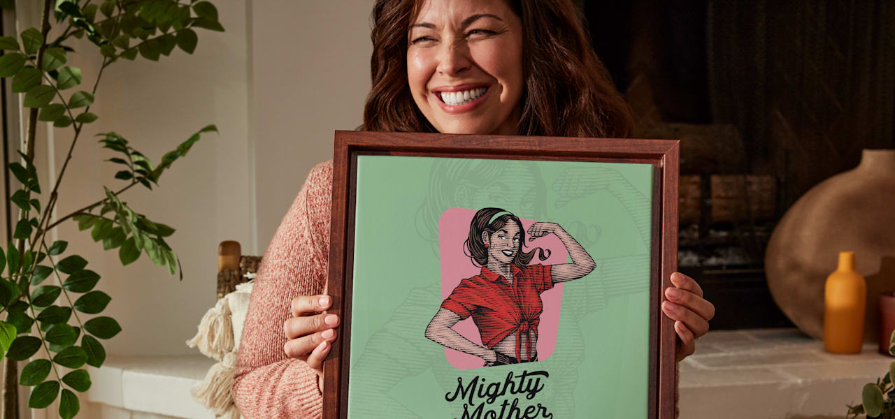 women holding print that says Mighty Mother