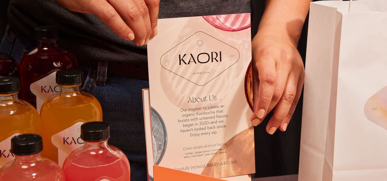 Marque image of a flyer being held beside some bottled products.