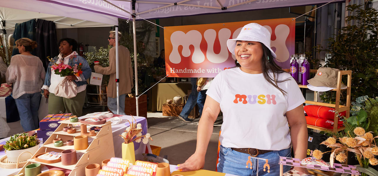 Smal business owner proudly presents outdoor stall