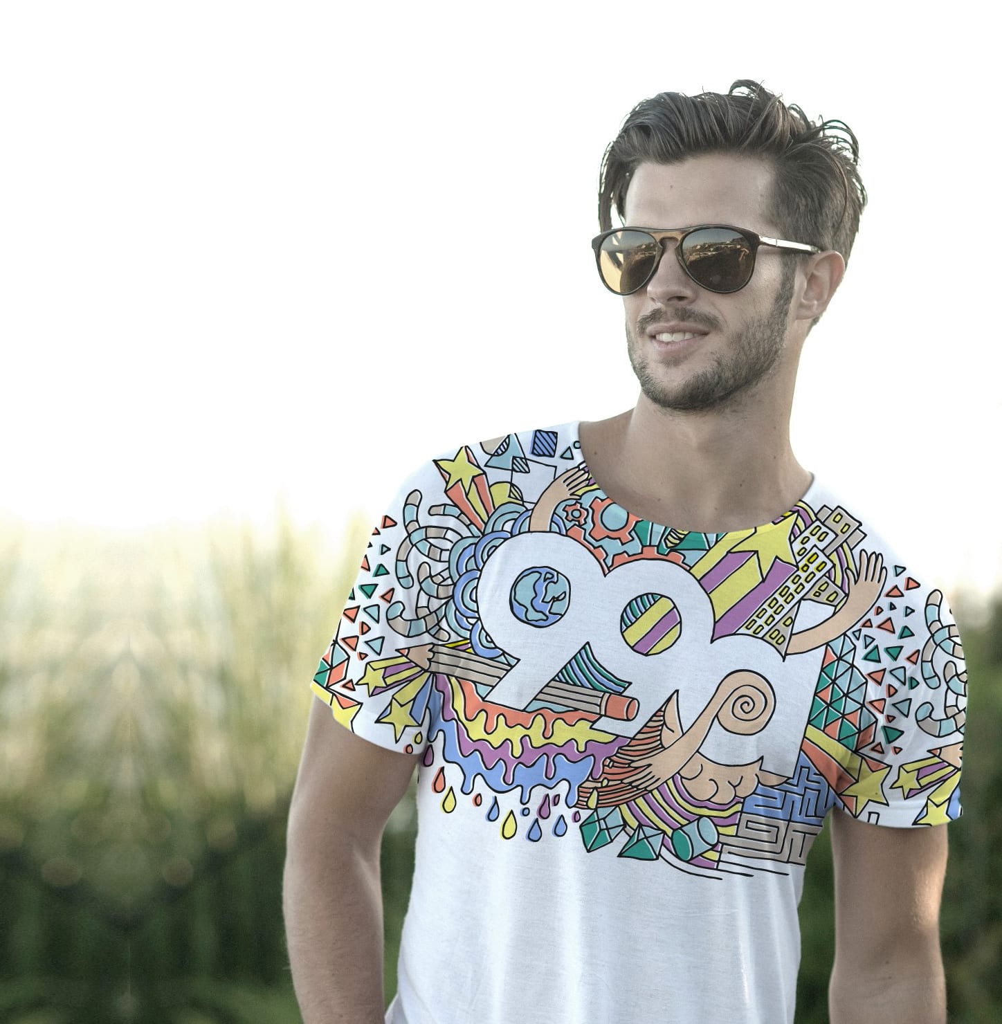 man wearing a colorful T-shirt featuring the 99designs by Vista logo