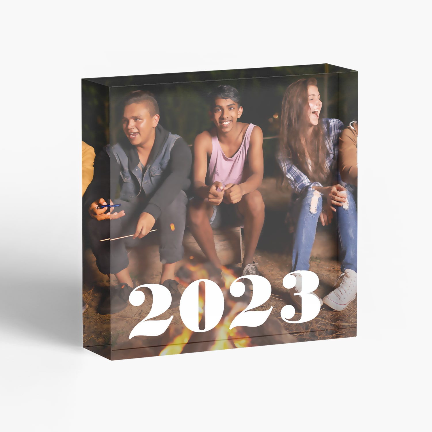 Acrylic photo block featuring three young people and text reading the year 2023
