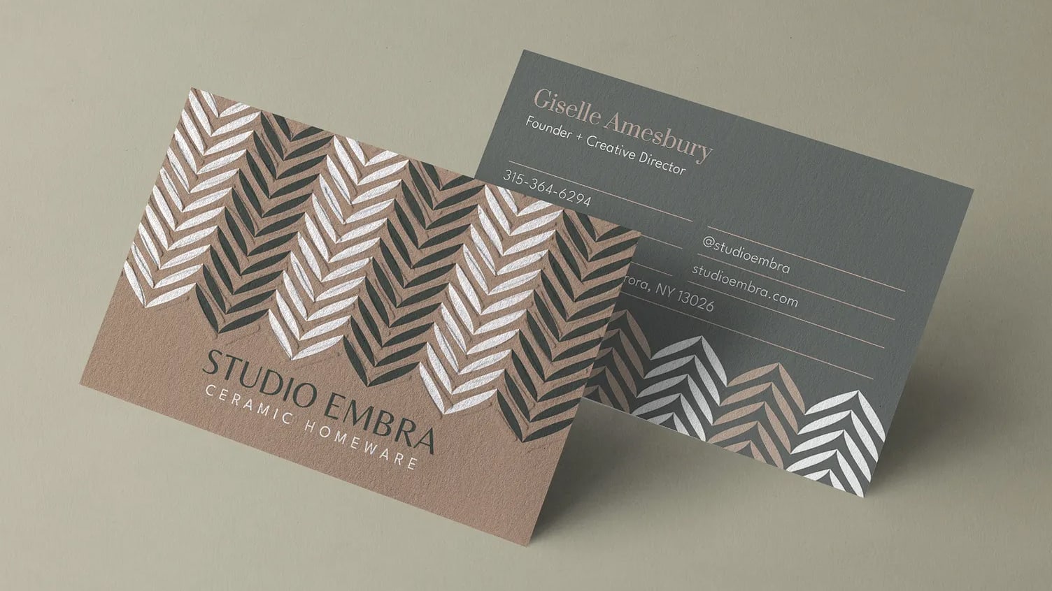 Brown letterpress business card with embossed chevron pattern
