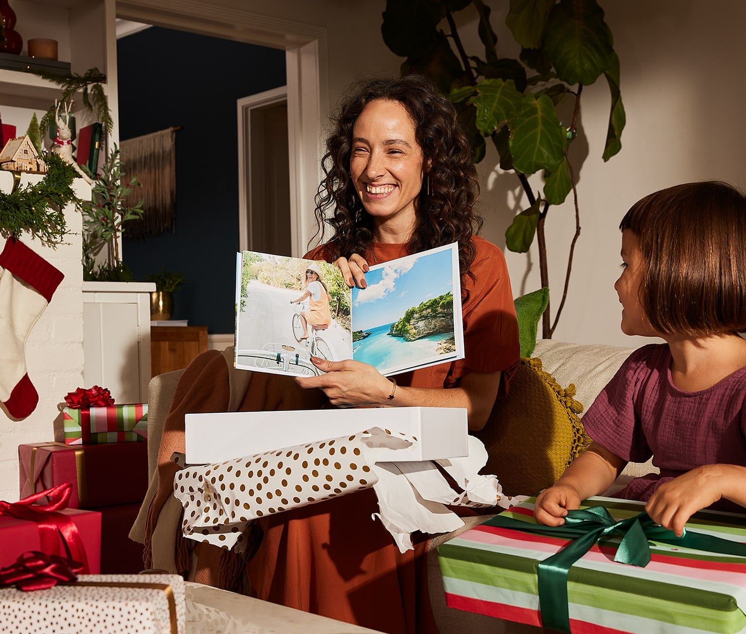 A person opening a gift of a photobook