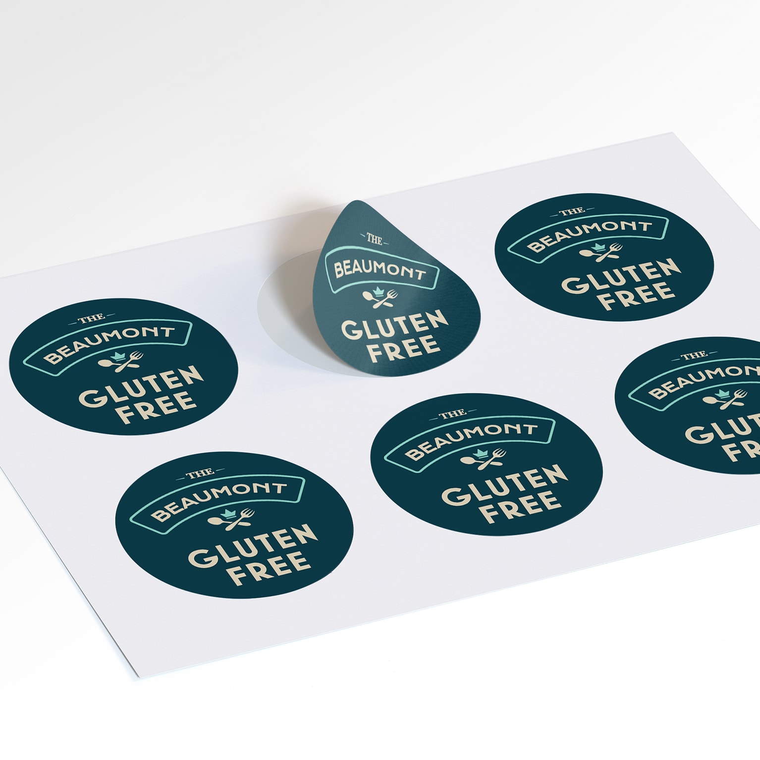 A sheet of custom round vinyl stickers for The Beaumont