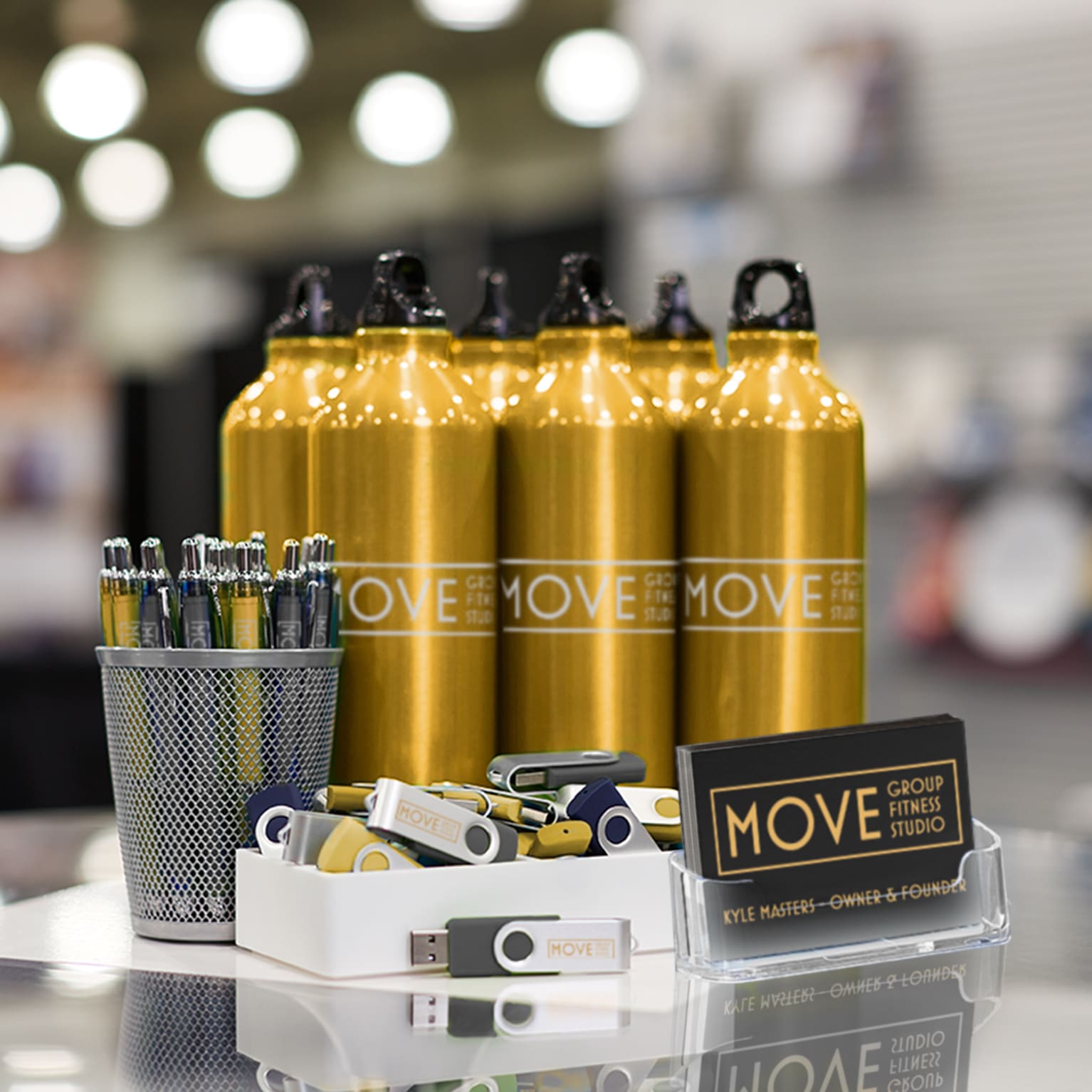 Water bottles and usb sticks on a table.