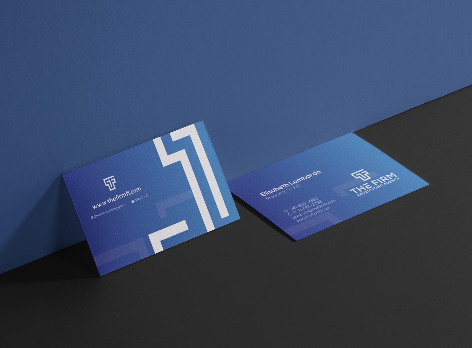 A mockup of a business card design that uses dark navy color for business card.
