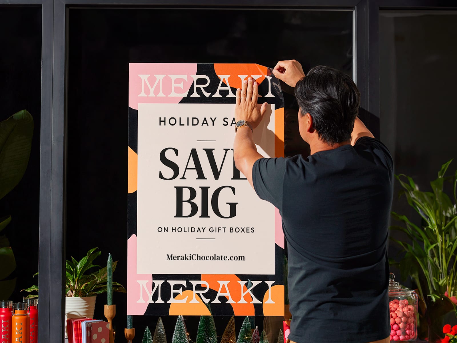 Festive window decal poster communicating a Christmas sale
