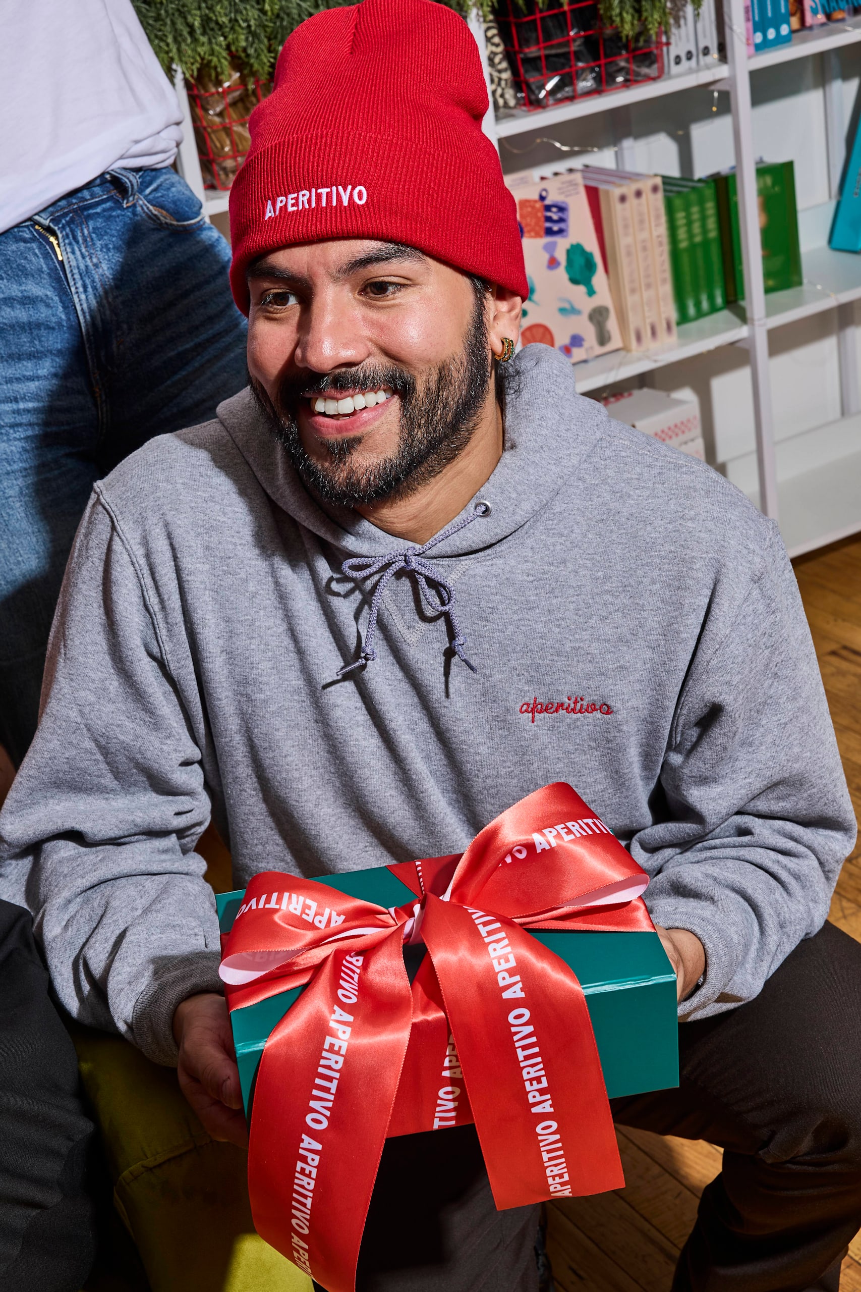 Man in branded Aperitivo beanie and hoodie.