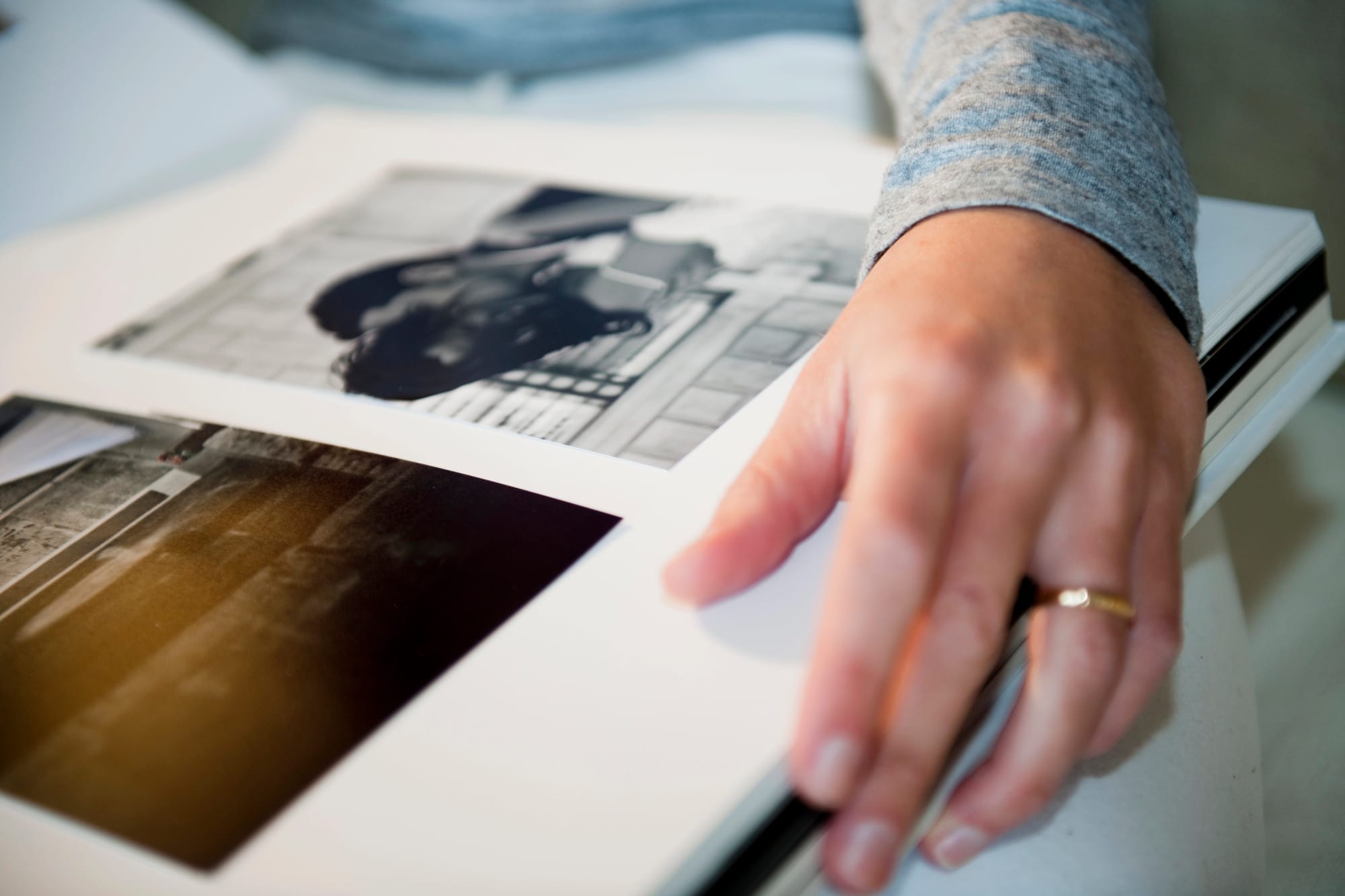 A person holding a wedding photo album