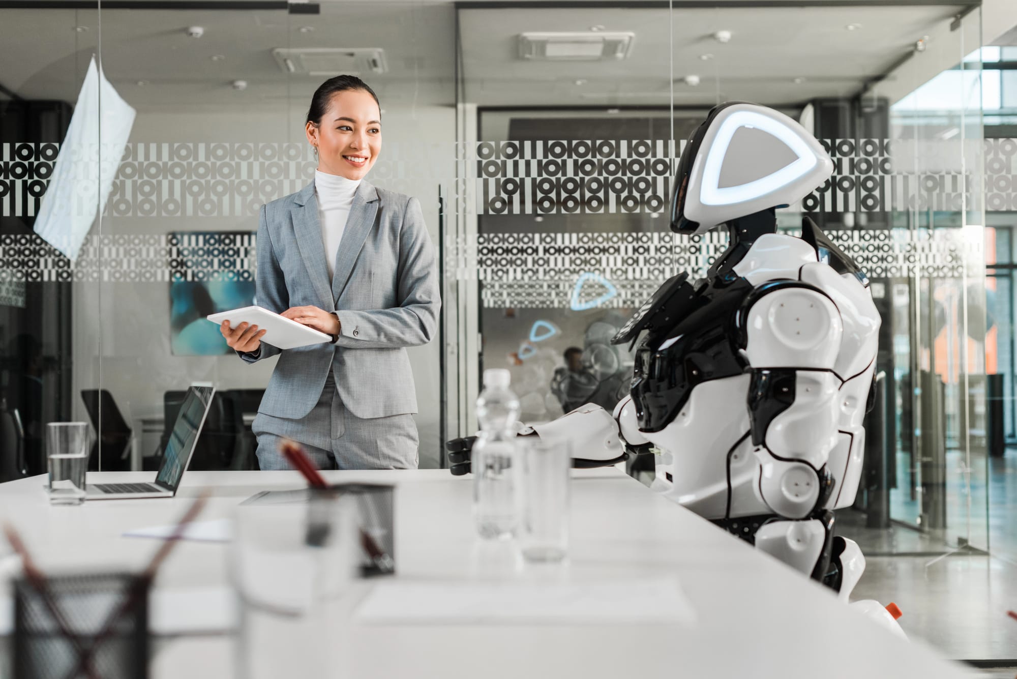 business women smiling at robot