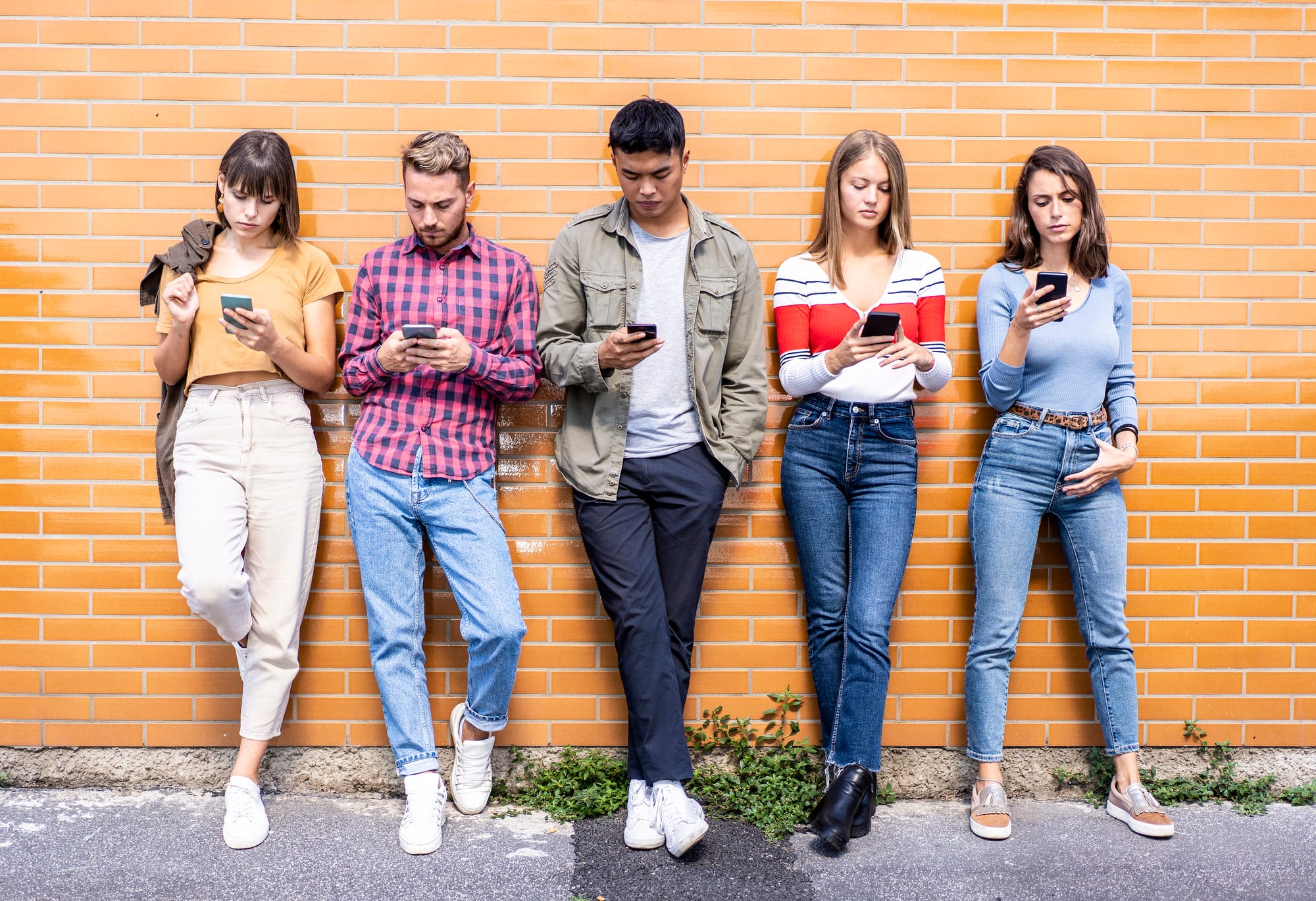 Gen Z looking at their smartphones