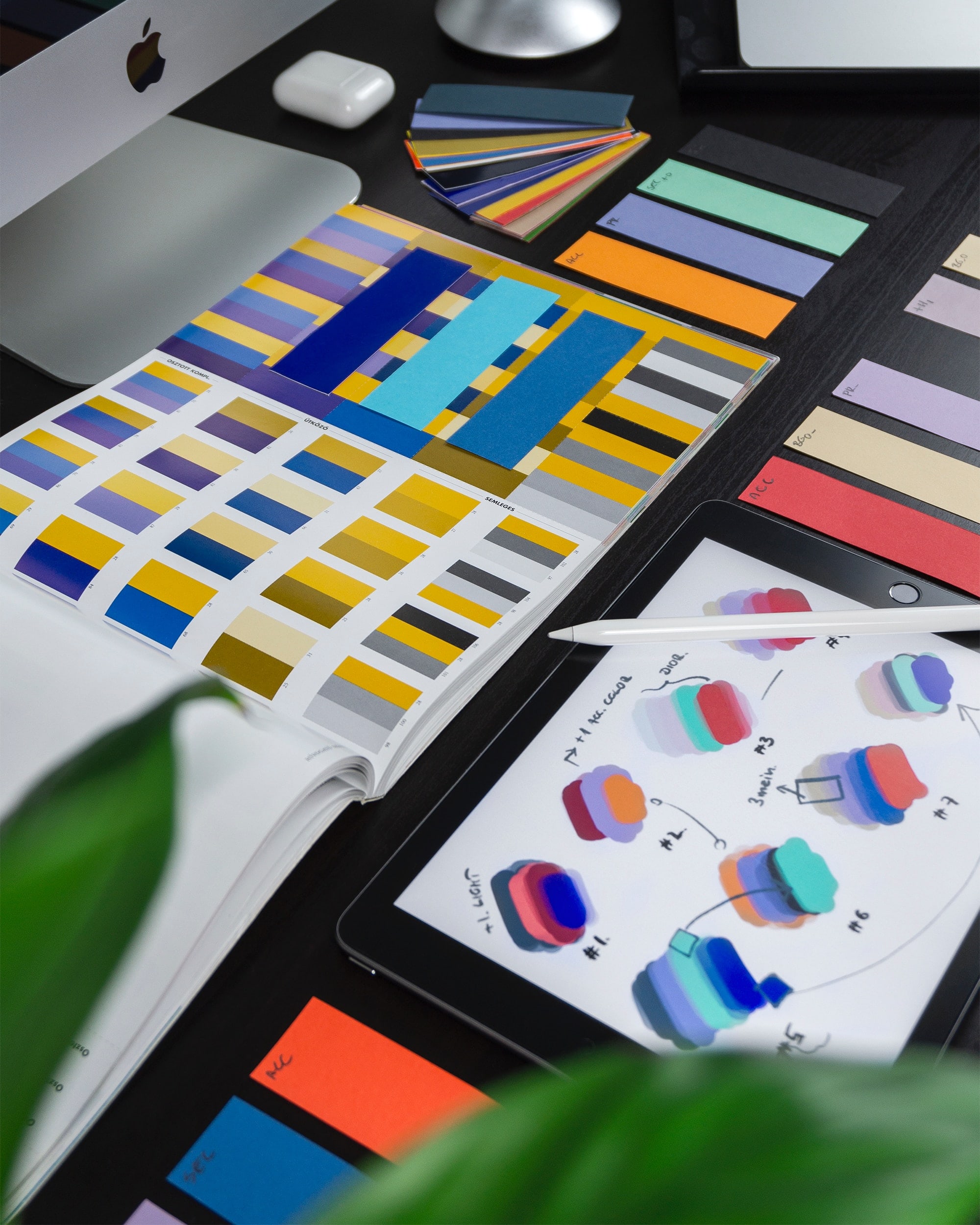 Colour swatches on a computer desk.