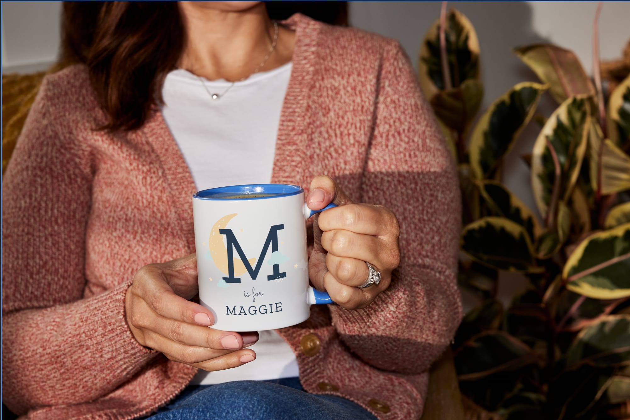 A custom mug with the baby’s initial