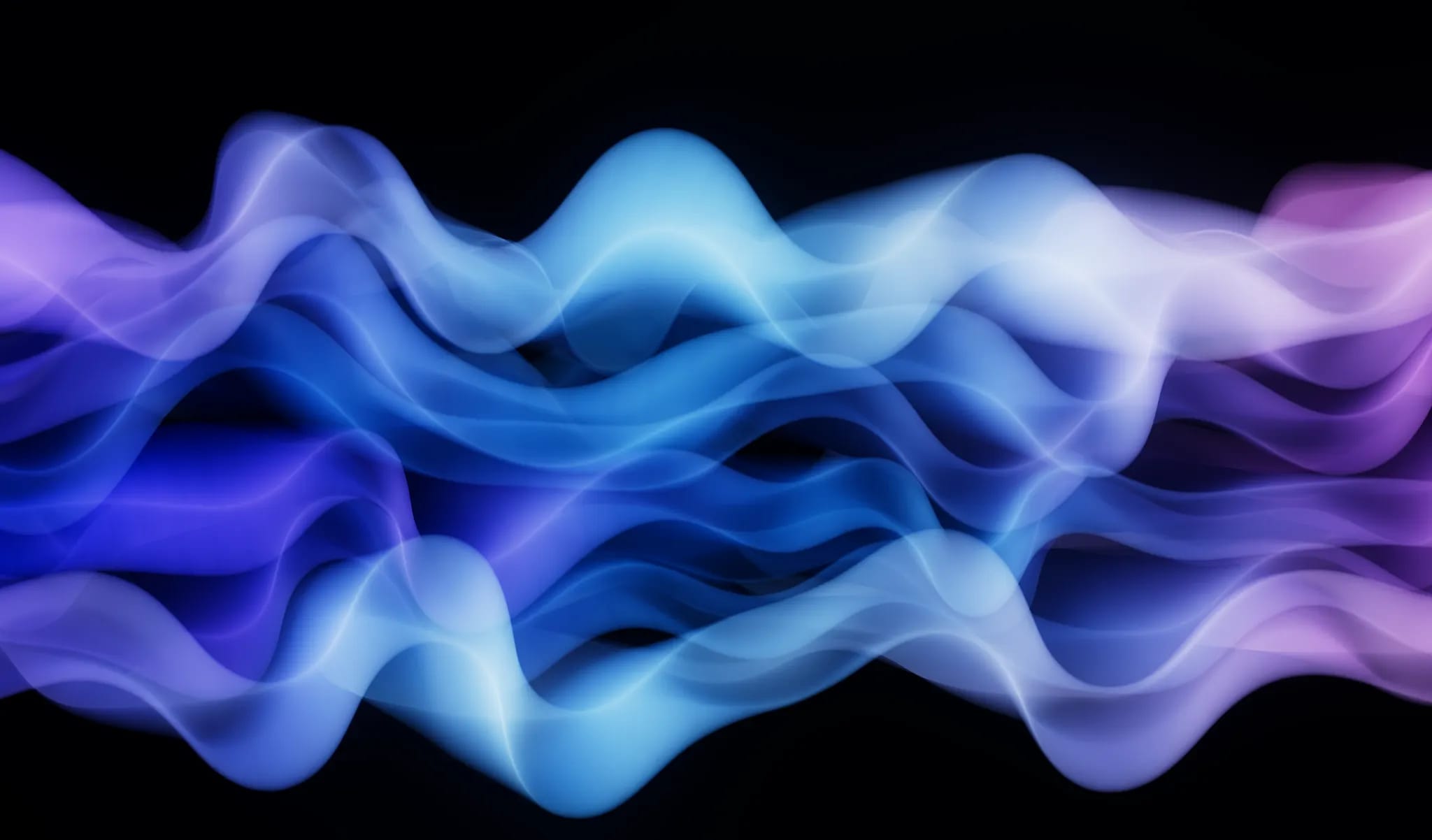 Exemple de couleurs Mermaidcore dans des dégradés de violet, bleu et rose, formant des vagues sur un fond noir.