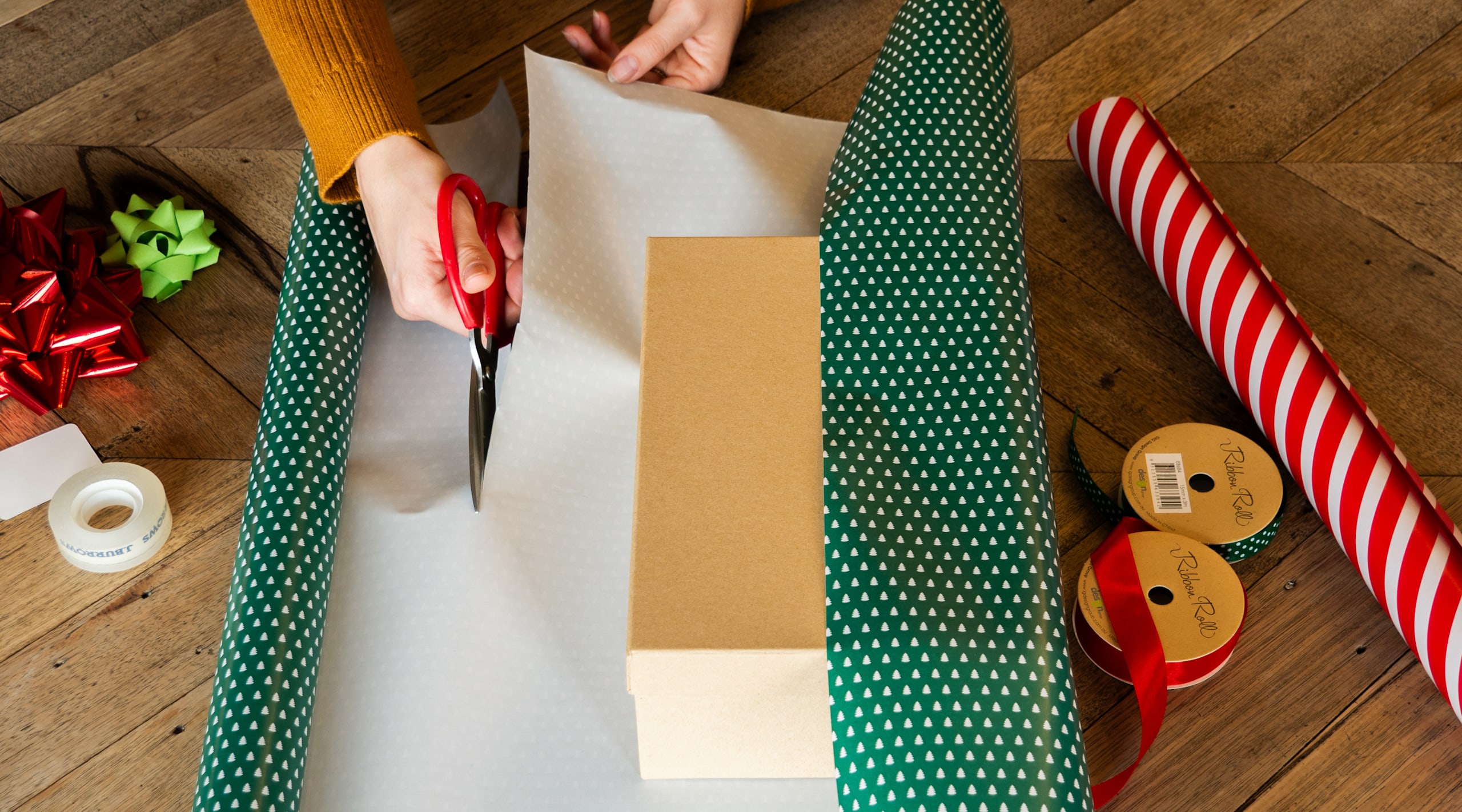 Measuring and cutting the wrapping paper for wrapping boxes