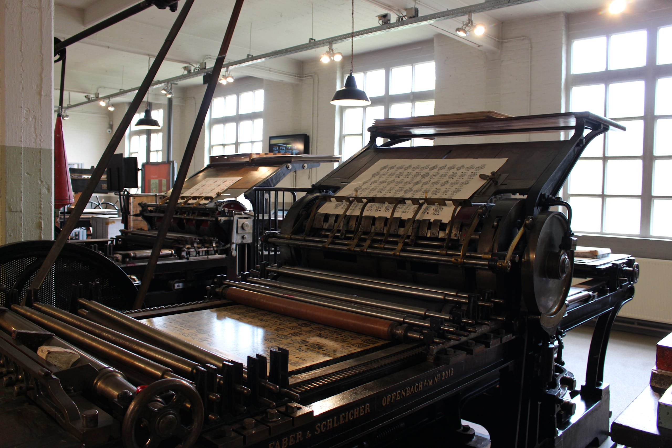 Old printing press in industrial room