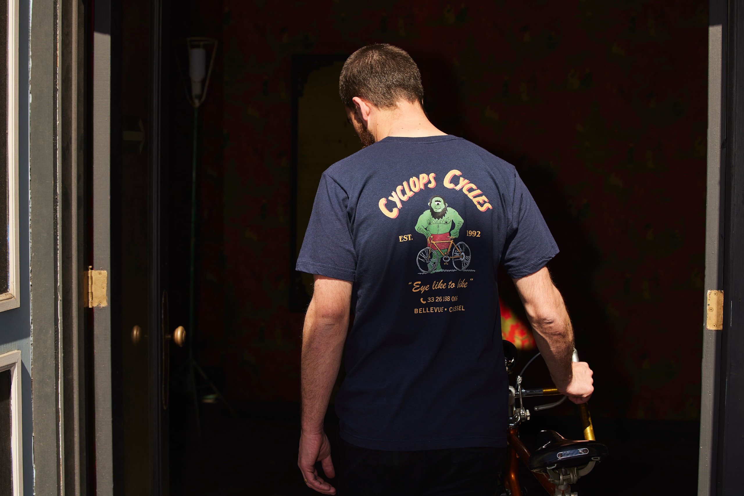 a man wearing a custom printed bike repair t-shirt