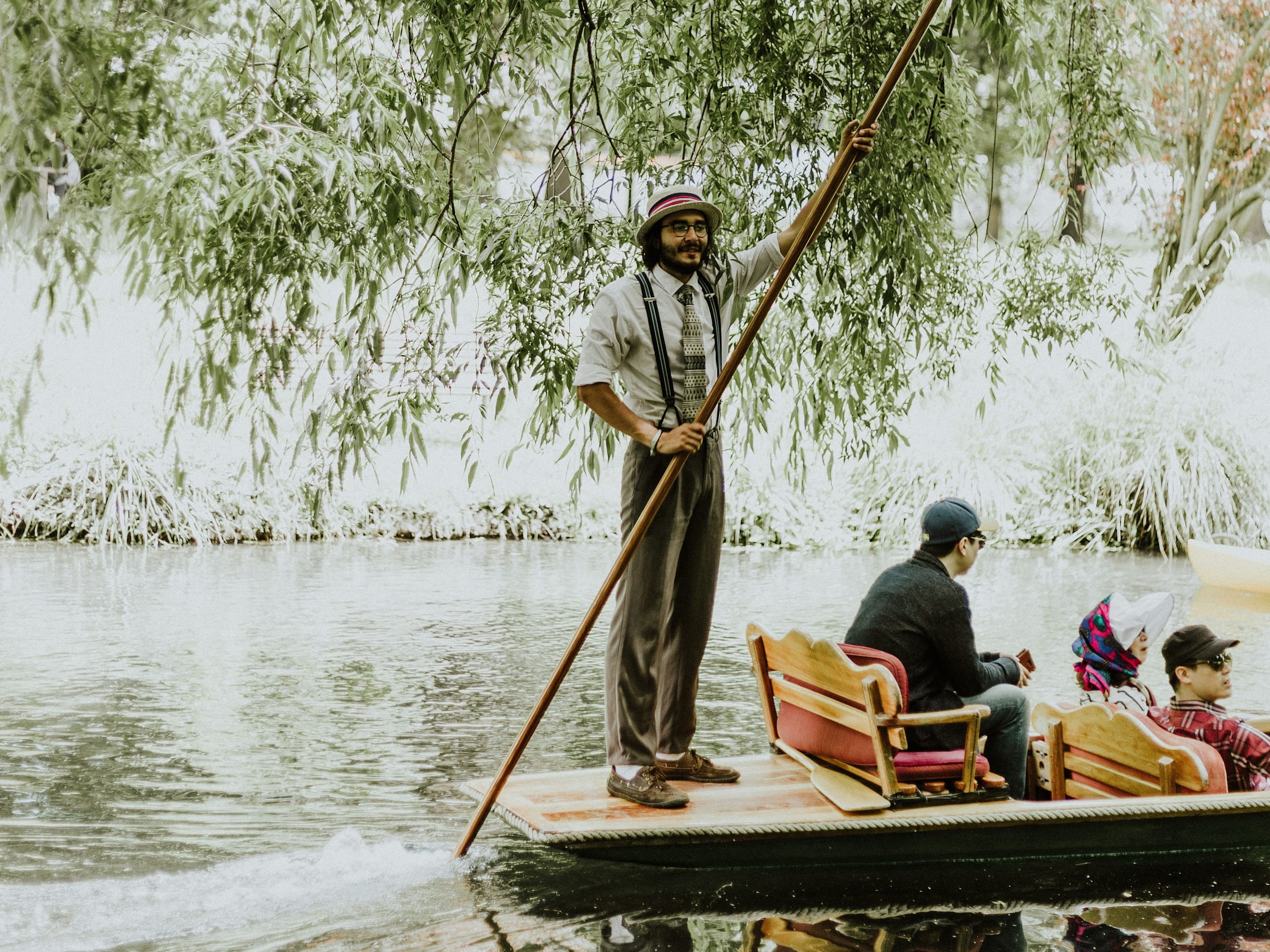 Man using a pole on a punt
